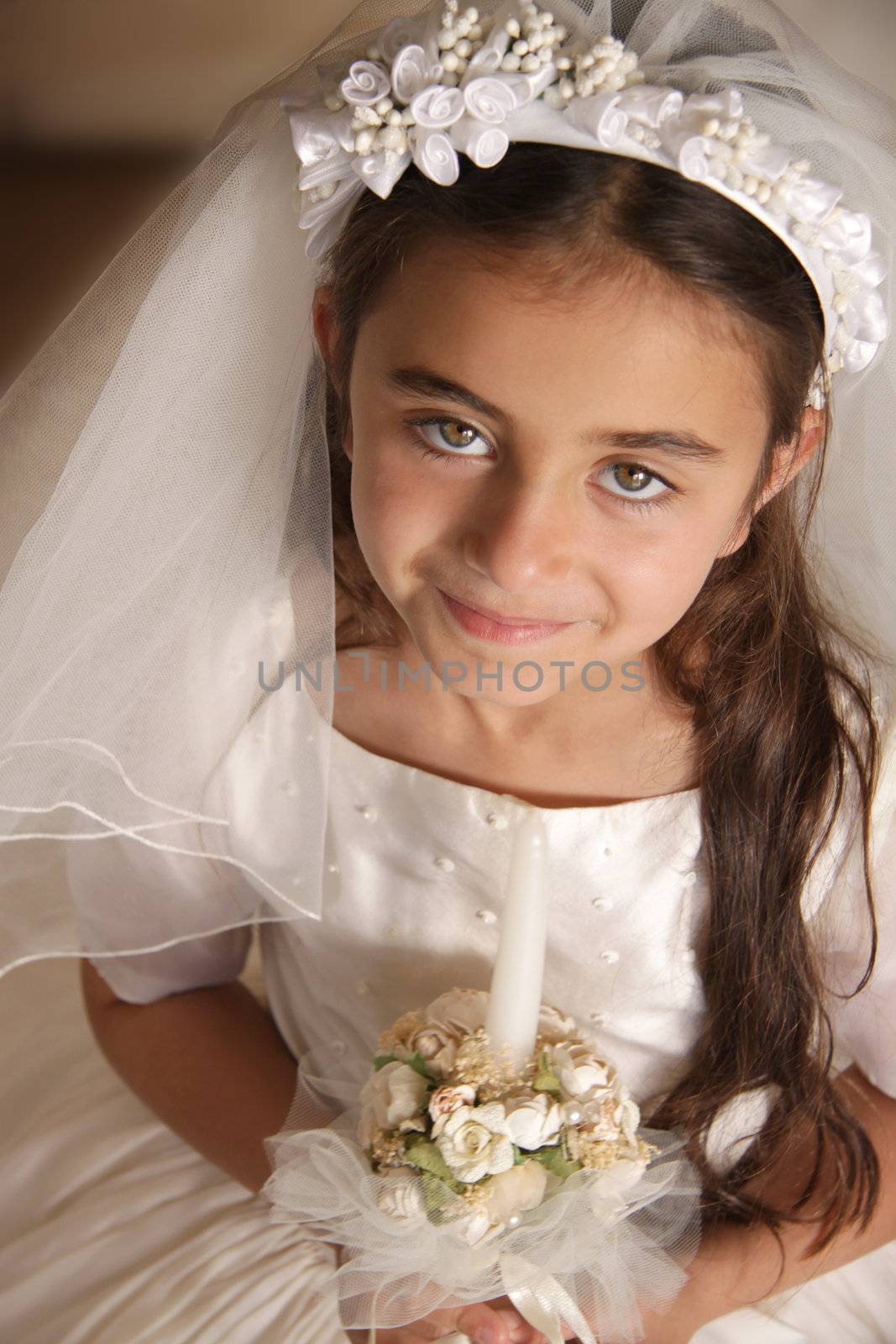 Beautiful girl celebrating her first communion