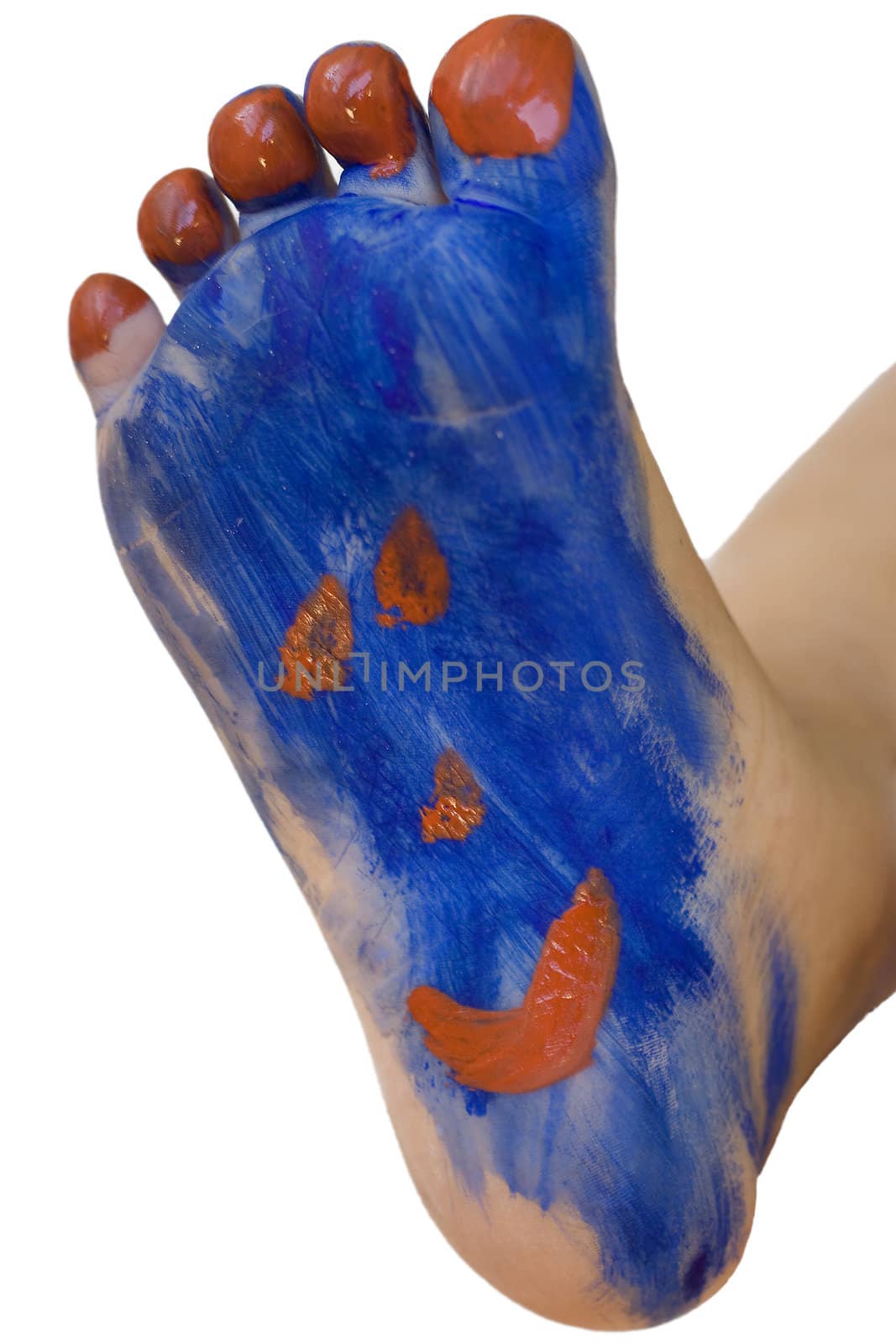 A toddler has painted her foot with a happy face. Foot paint. Isolated on white