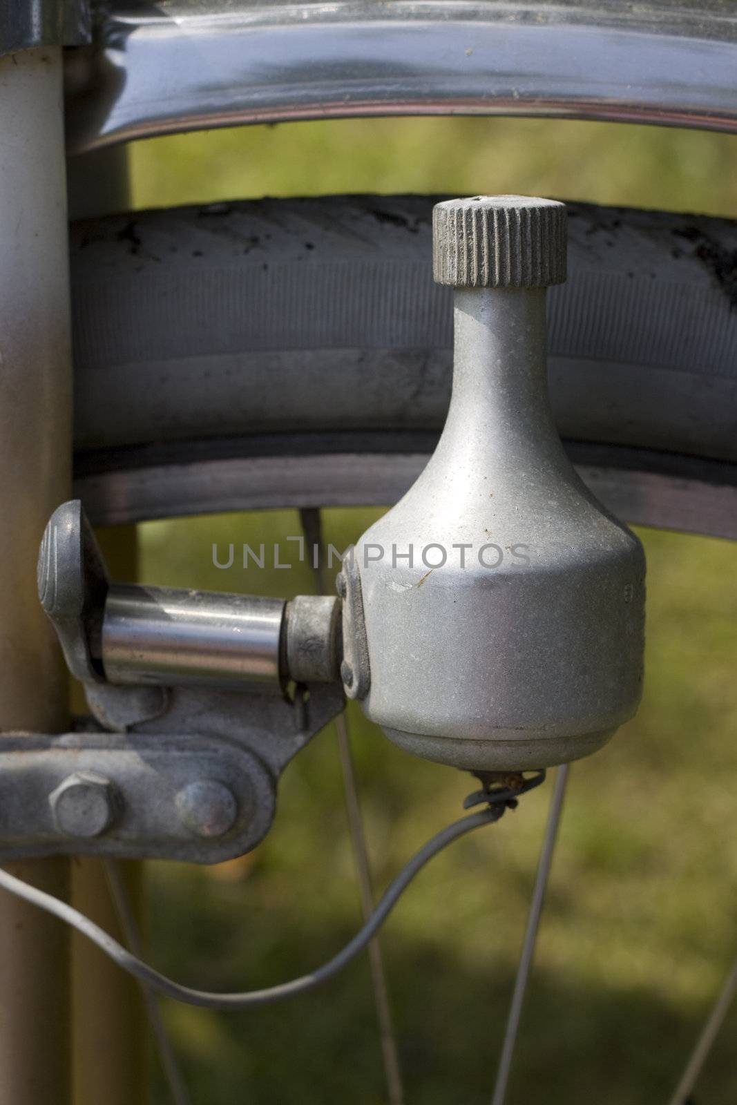 Close up of a bicycle dynamo, a small generator making the lamp of the bicycle light up when padelling