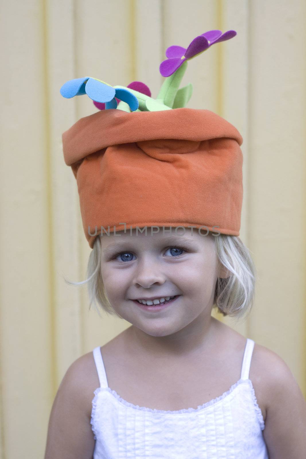 Girl wearing a funny hat with flowers