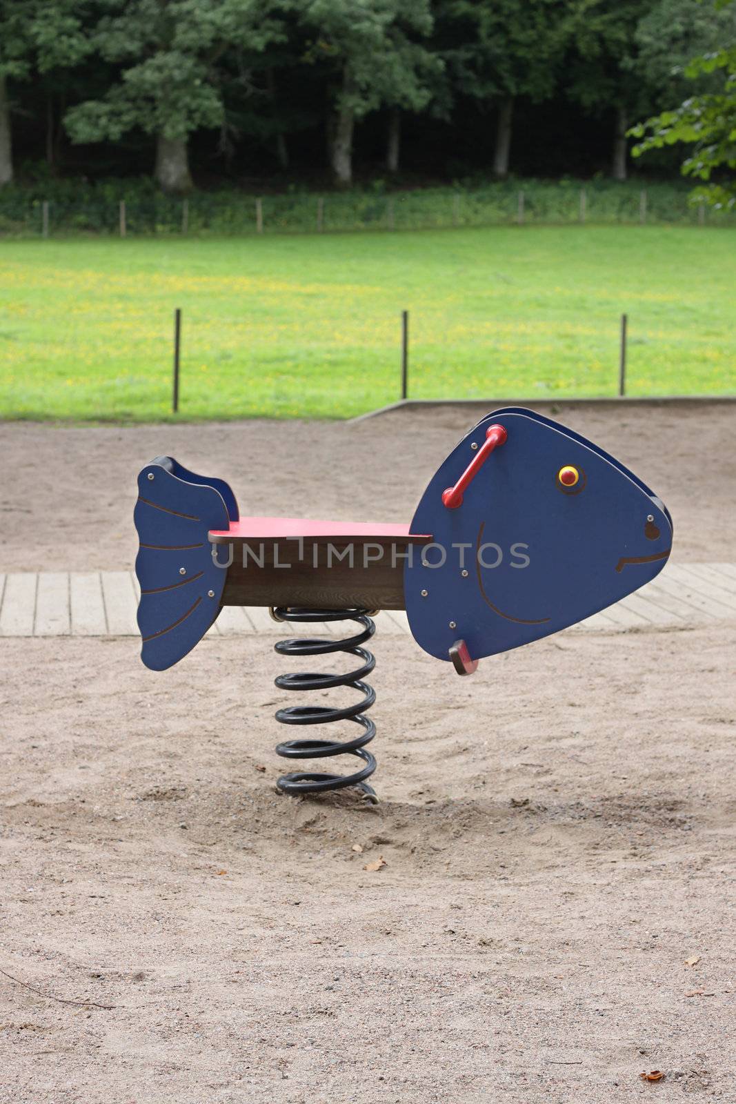 A fish shaped swinging see-saw in a Swedish playground