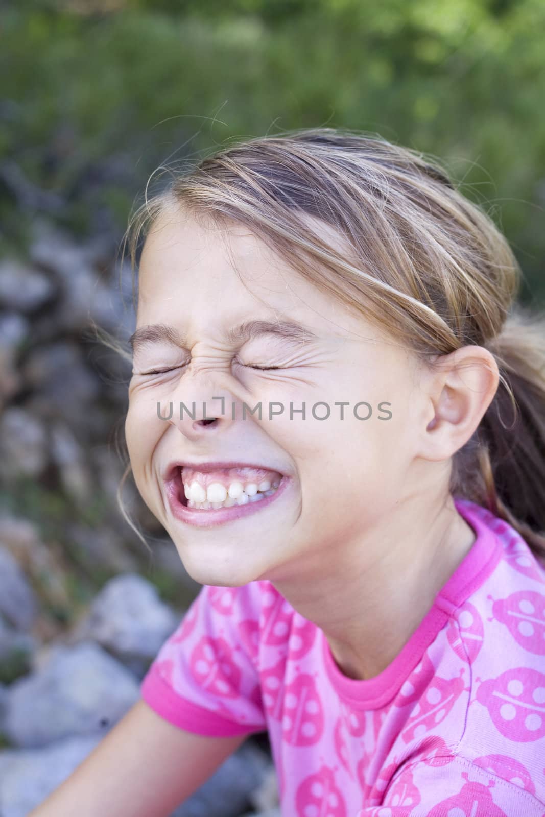 A young girl pulling a funny face