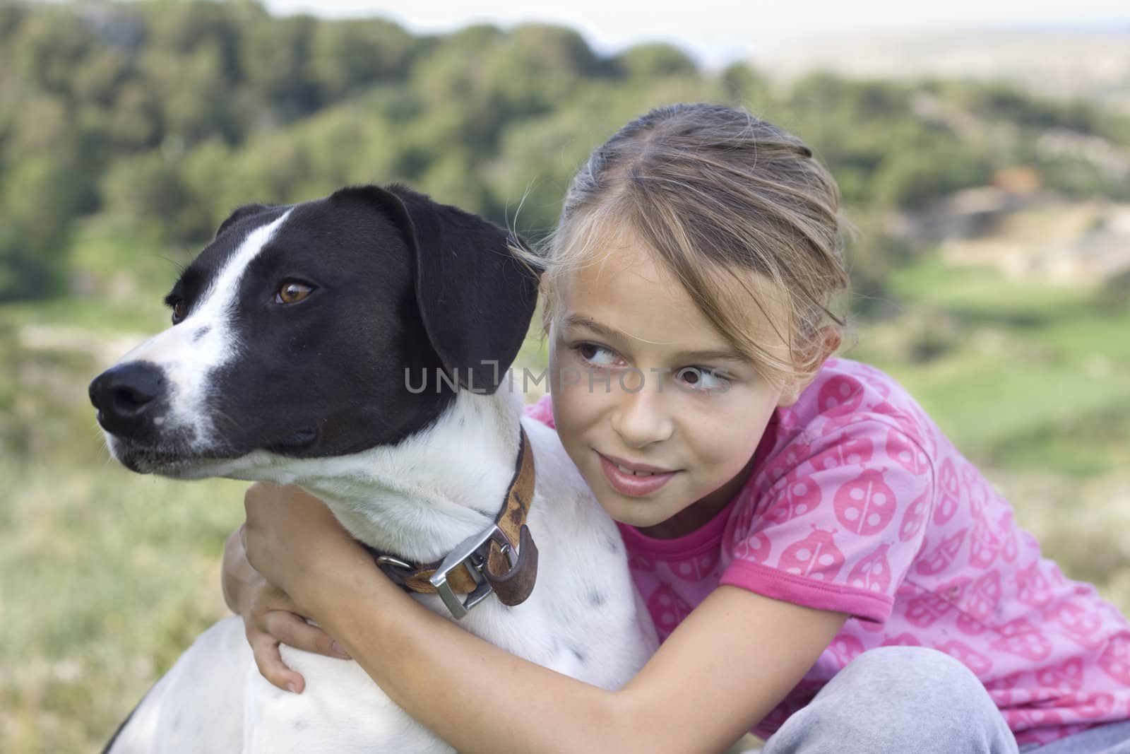 10 year old girl together with her dog