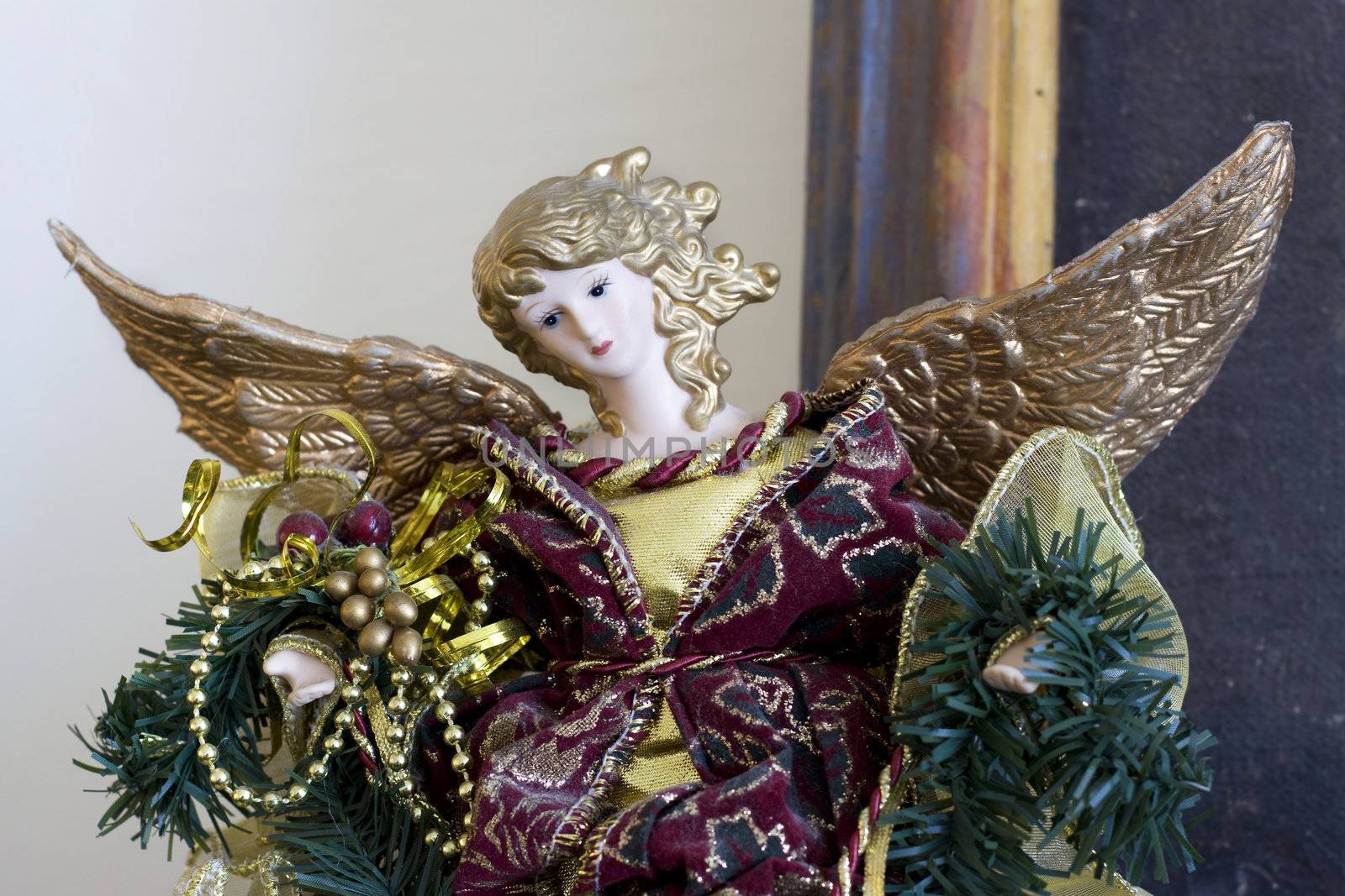 Horizontal photo of a christmas statue on a mantel piece