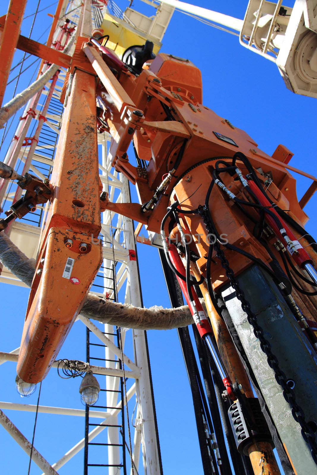 Close up of an oil pump with blue sky