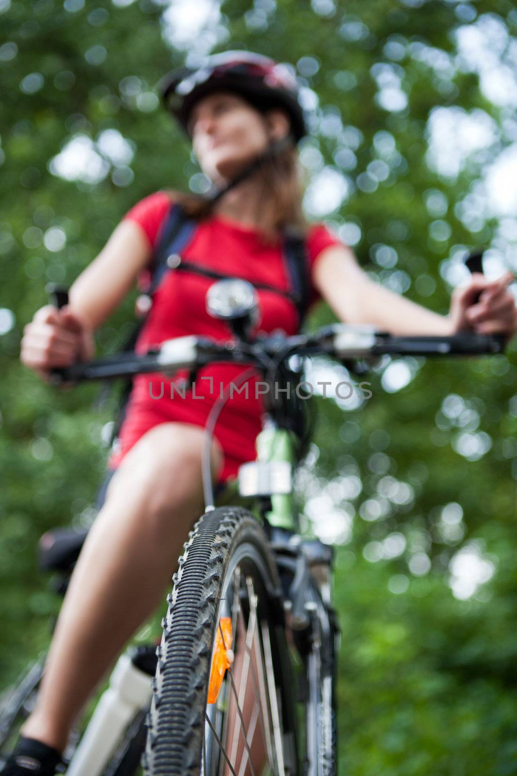 pretty young female biker outddors on her mountain bike by viktor_cap