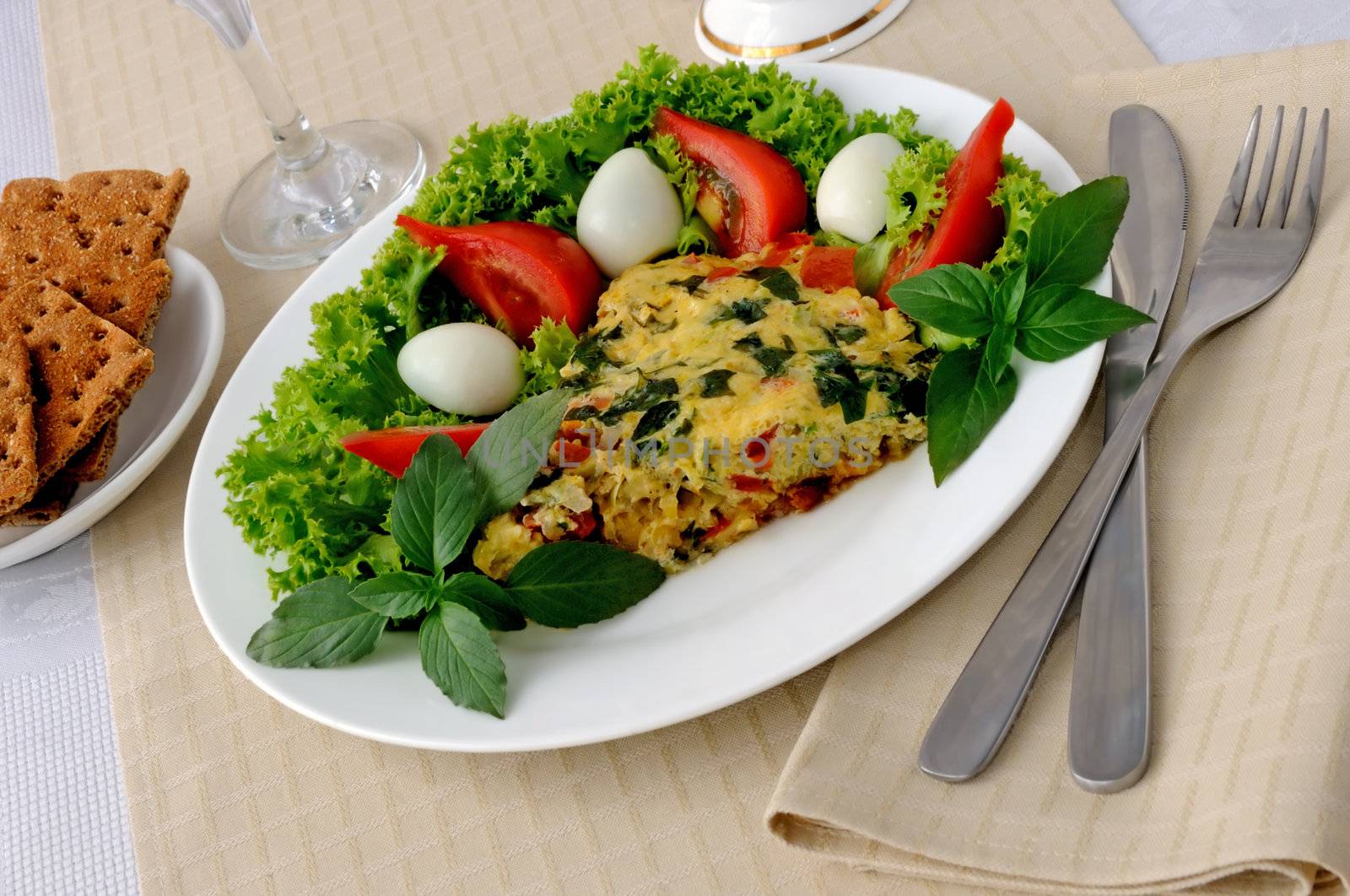 Omelete with zucchini vegetables with basil and lettuce