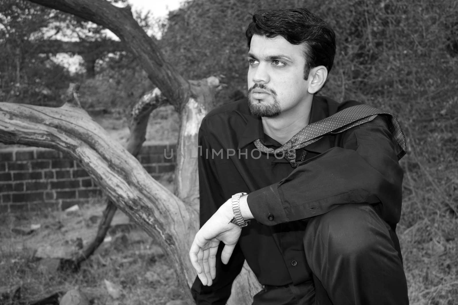 A black & white portrait of a visionary young Indian businessman.