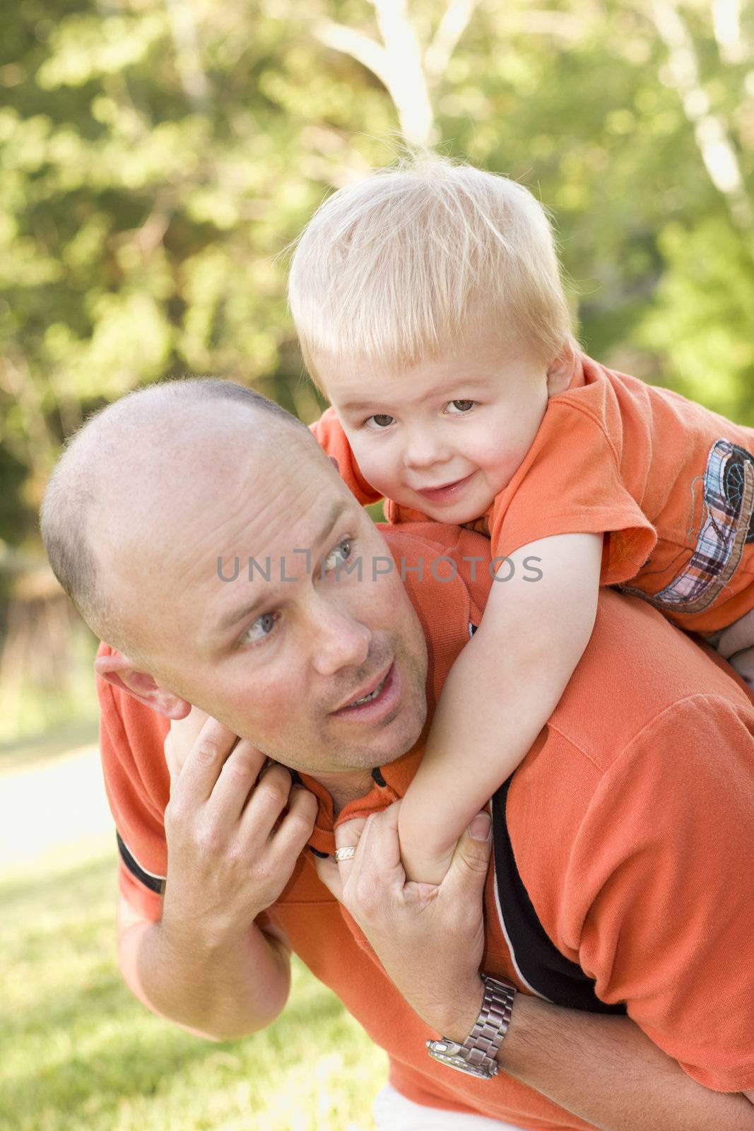 Father and Son Piggyback in the Park by Feverpitched