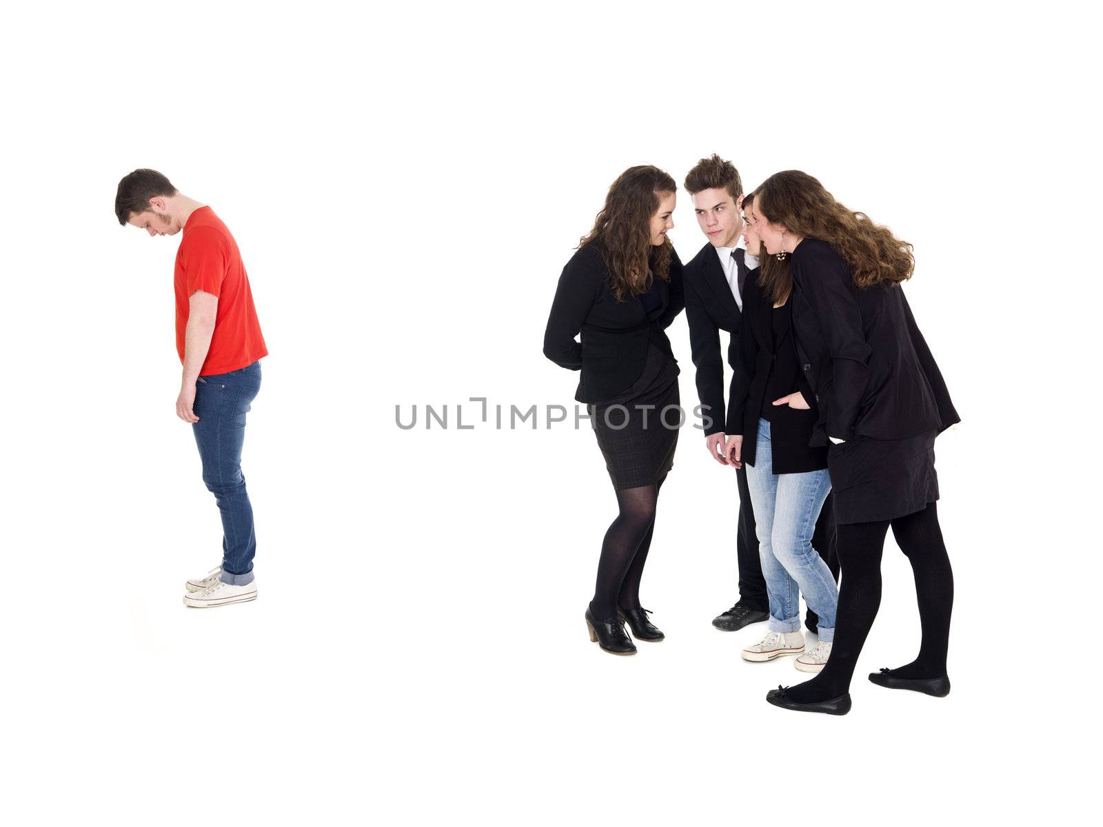 Young man rejected from the group isolated on white background