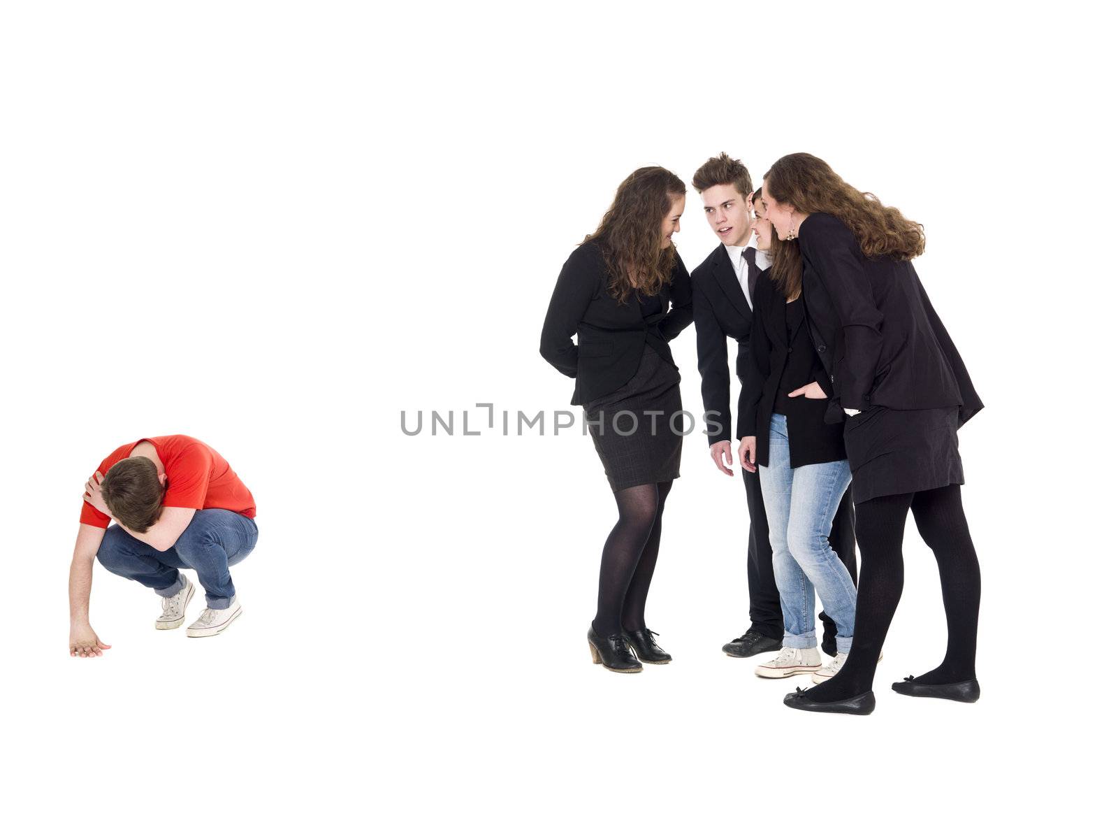 Young man rejected from the group isolated on white background