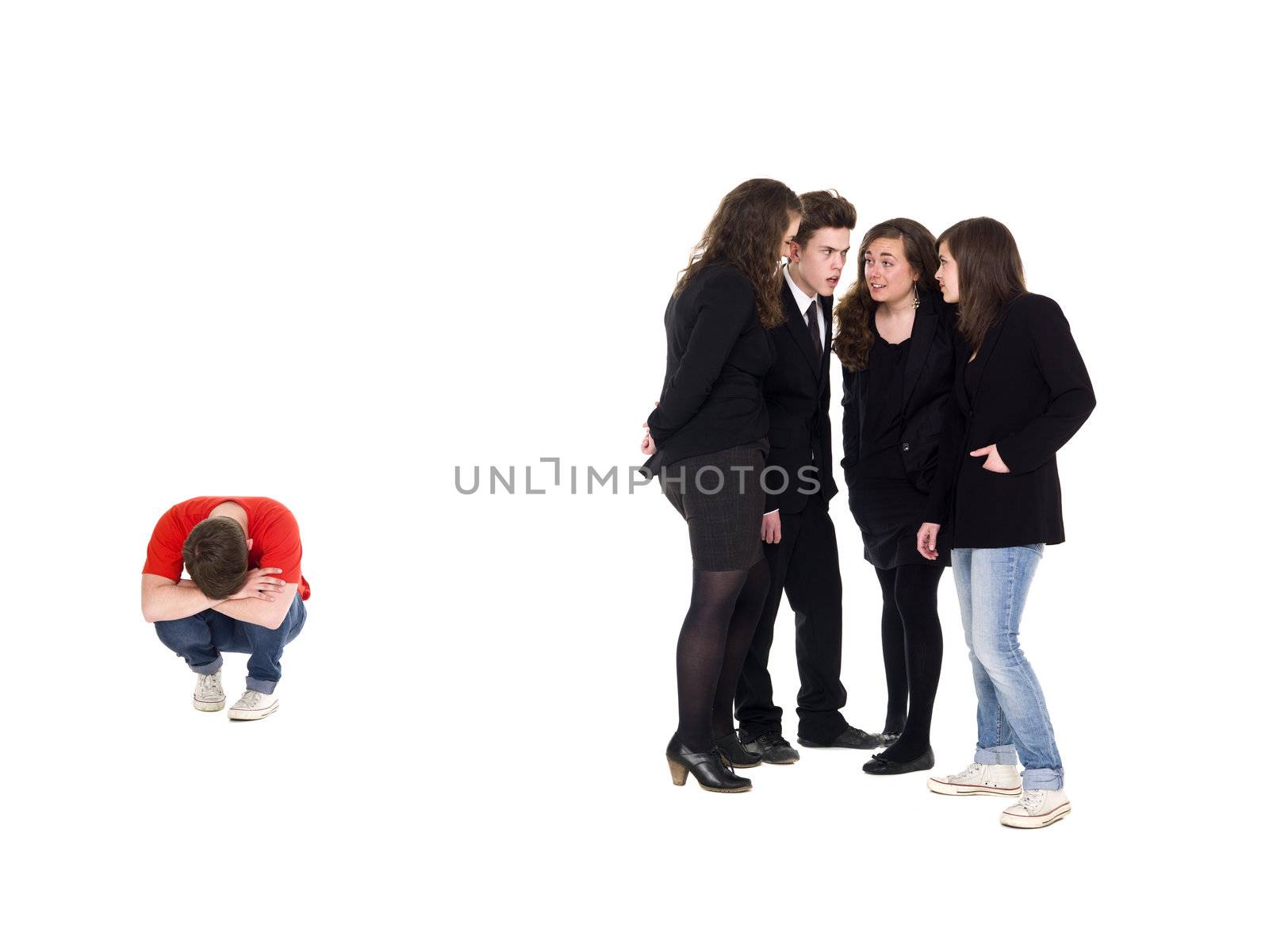 Young man rejected from the group isolated on white background