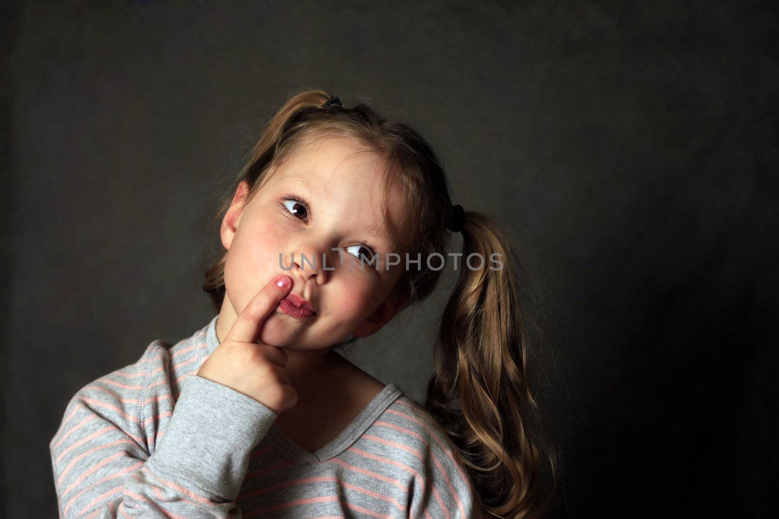 Portrait 5 years girl in studio