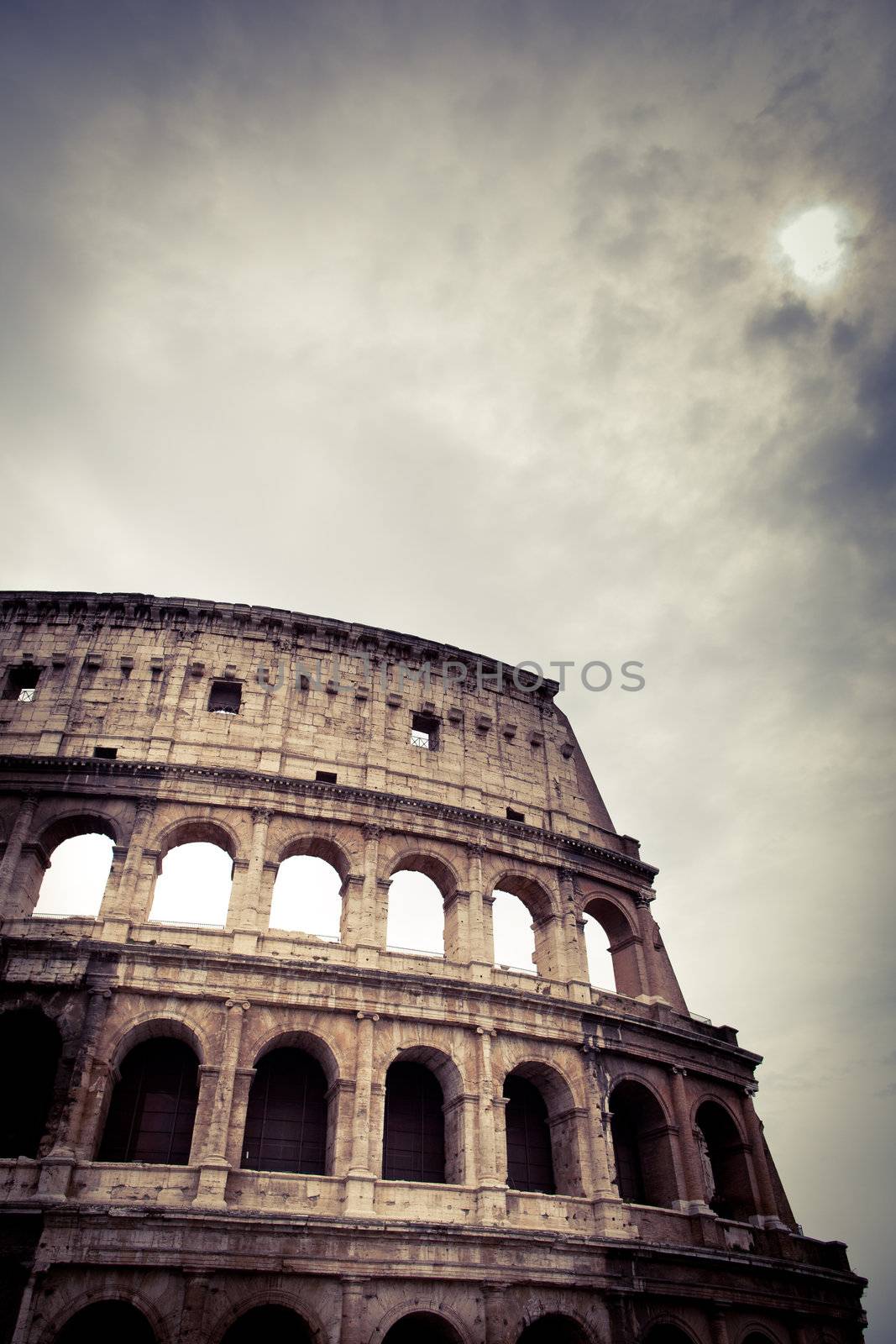 Colosseum against the sky - detailed view of the ancient Roman arena in black and white