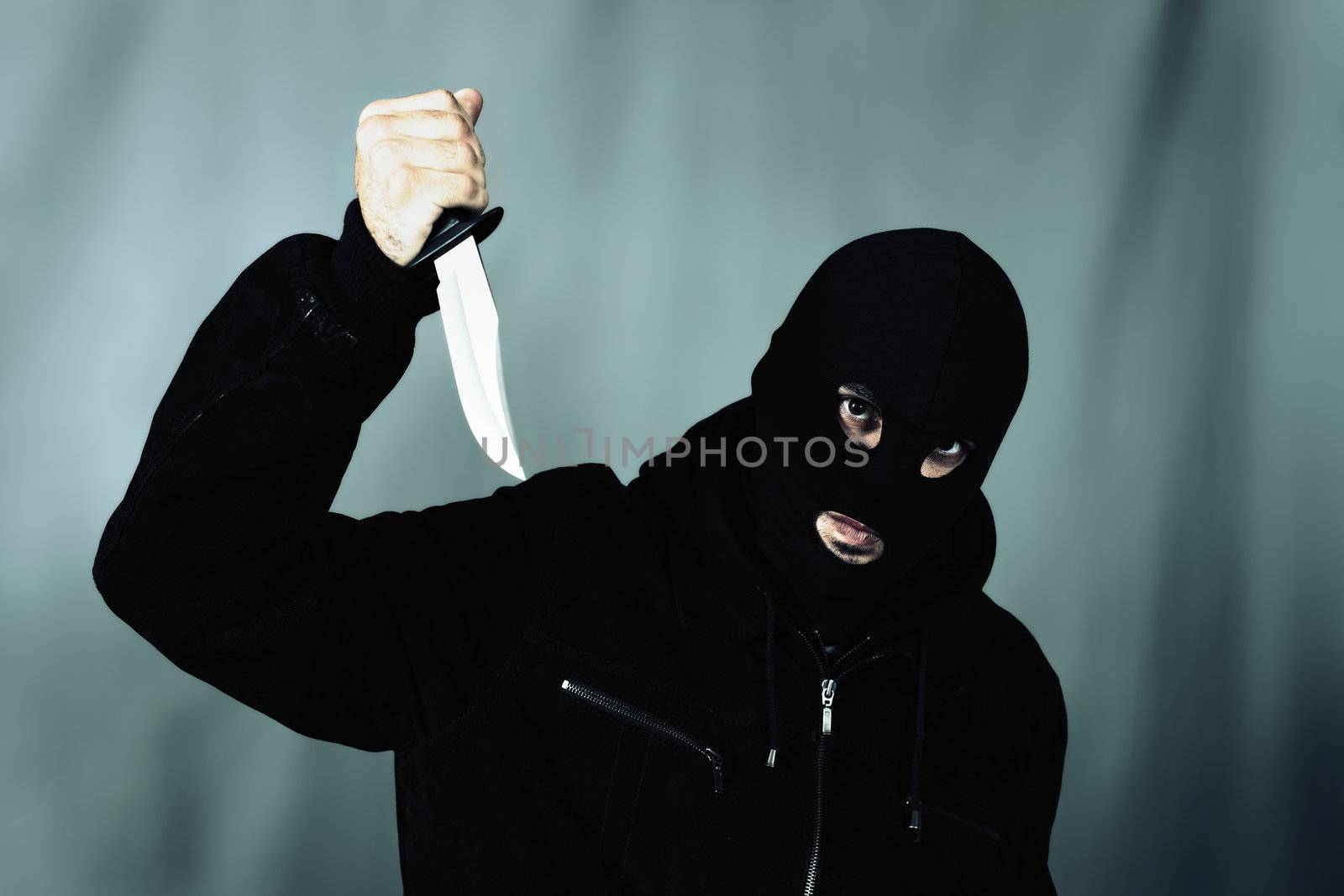 man with a knife and special photographic processing