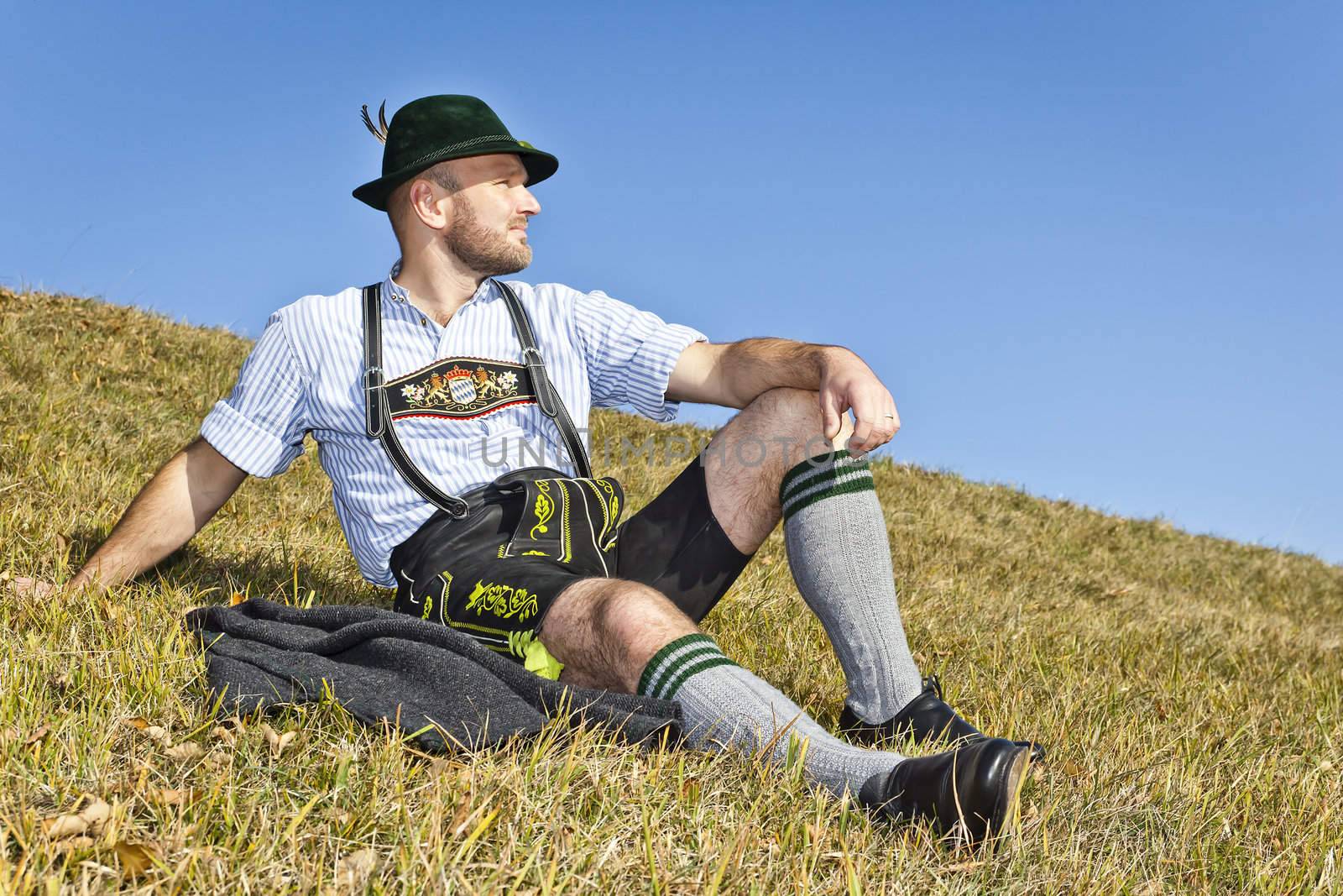 A traditional bavarian man in the autumn nature