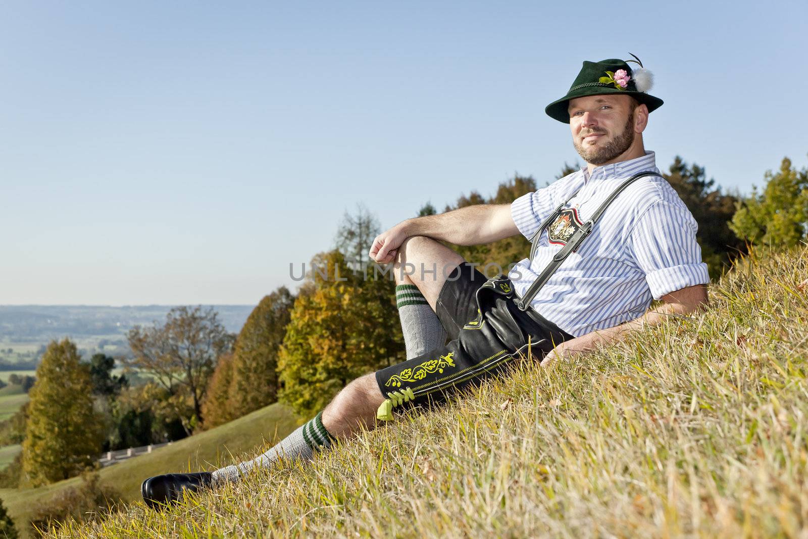 A traditional bavarian man in the autumn nature