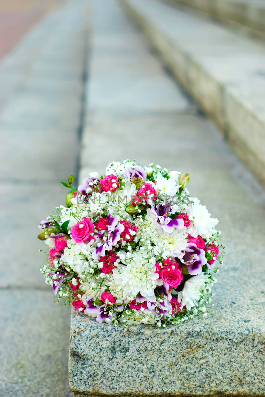 Bridal bouquet on the stone stairs
