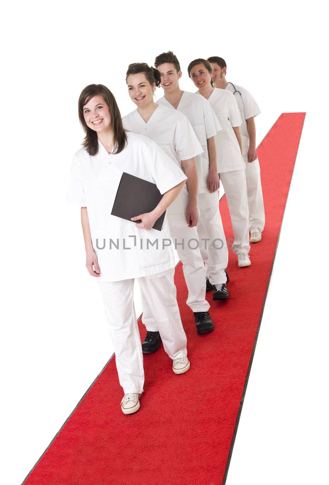 Medical Team on a red Carpet isolated on white background