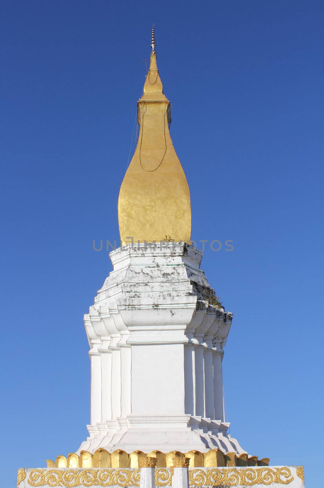 Beautiful golden pagpda with blue sky, Laos