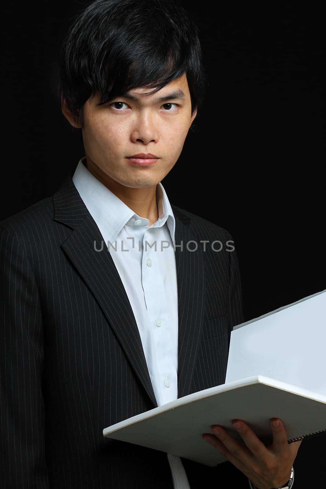 asia man holding folder by cozyta