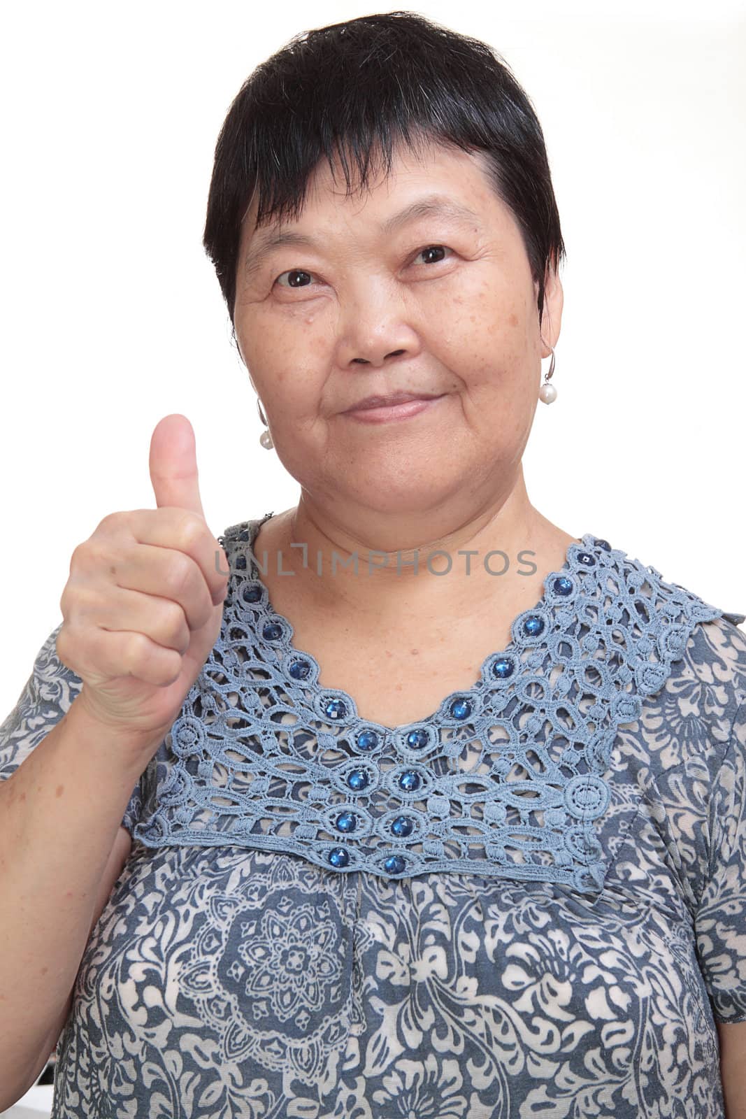 Happy Asian young woman give you an excellent gesture with frien by cozyta
