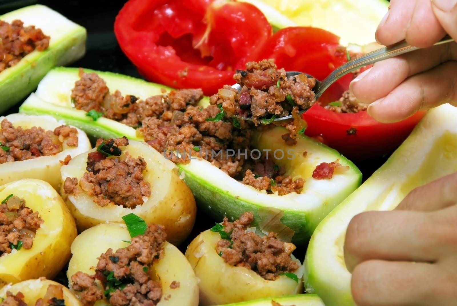 preparing fresh stuffed vegetables with minced meat