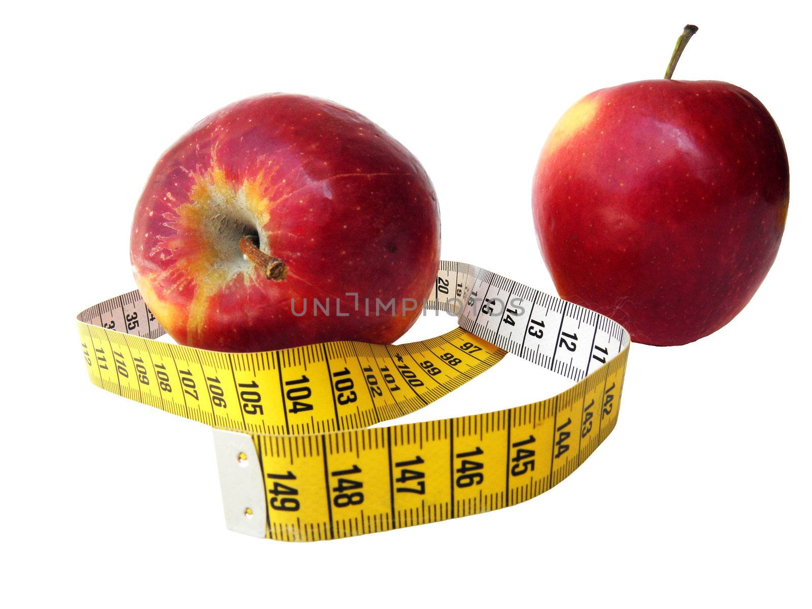 Two apples photographed with a meter to measure between them. Symbolically showing a healthy food and going on a diet.