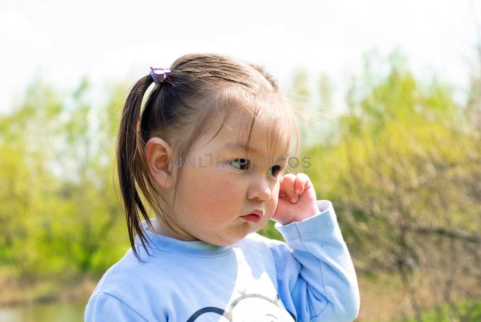 Baby girl on the meadow