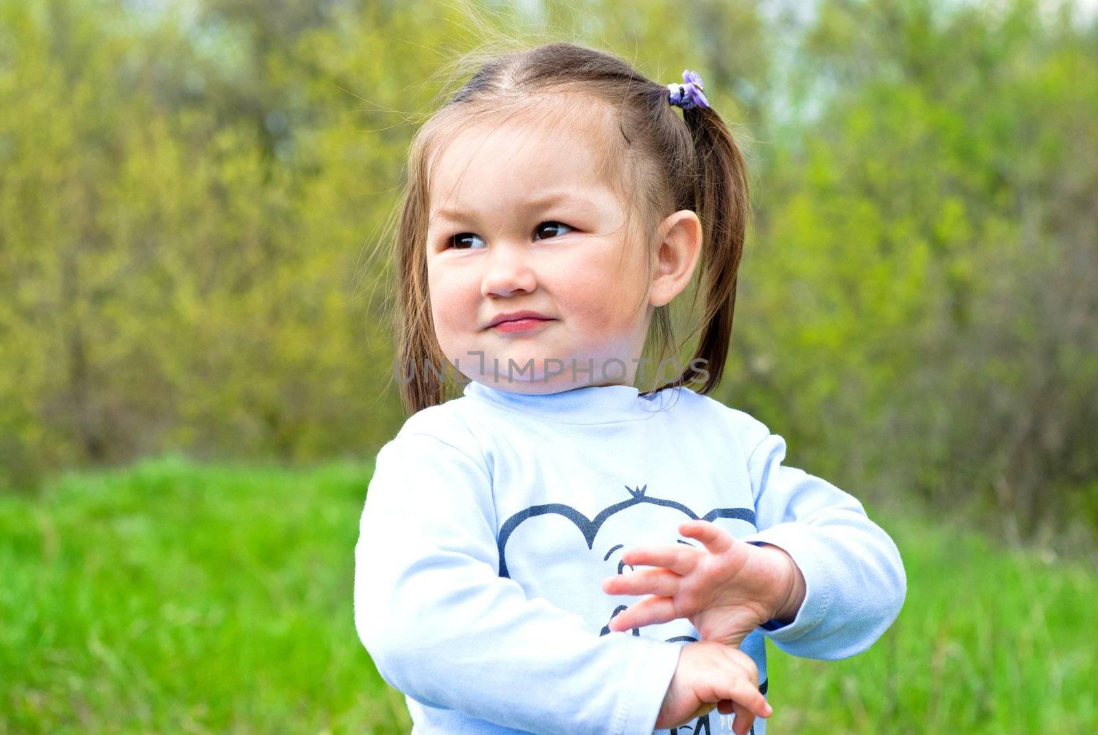 Baby girl on the meadow