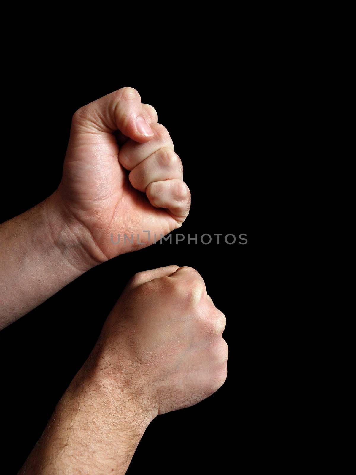 Men's hands. Photographed in a combat stance.