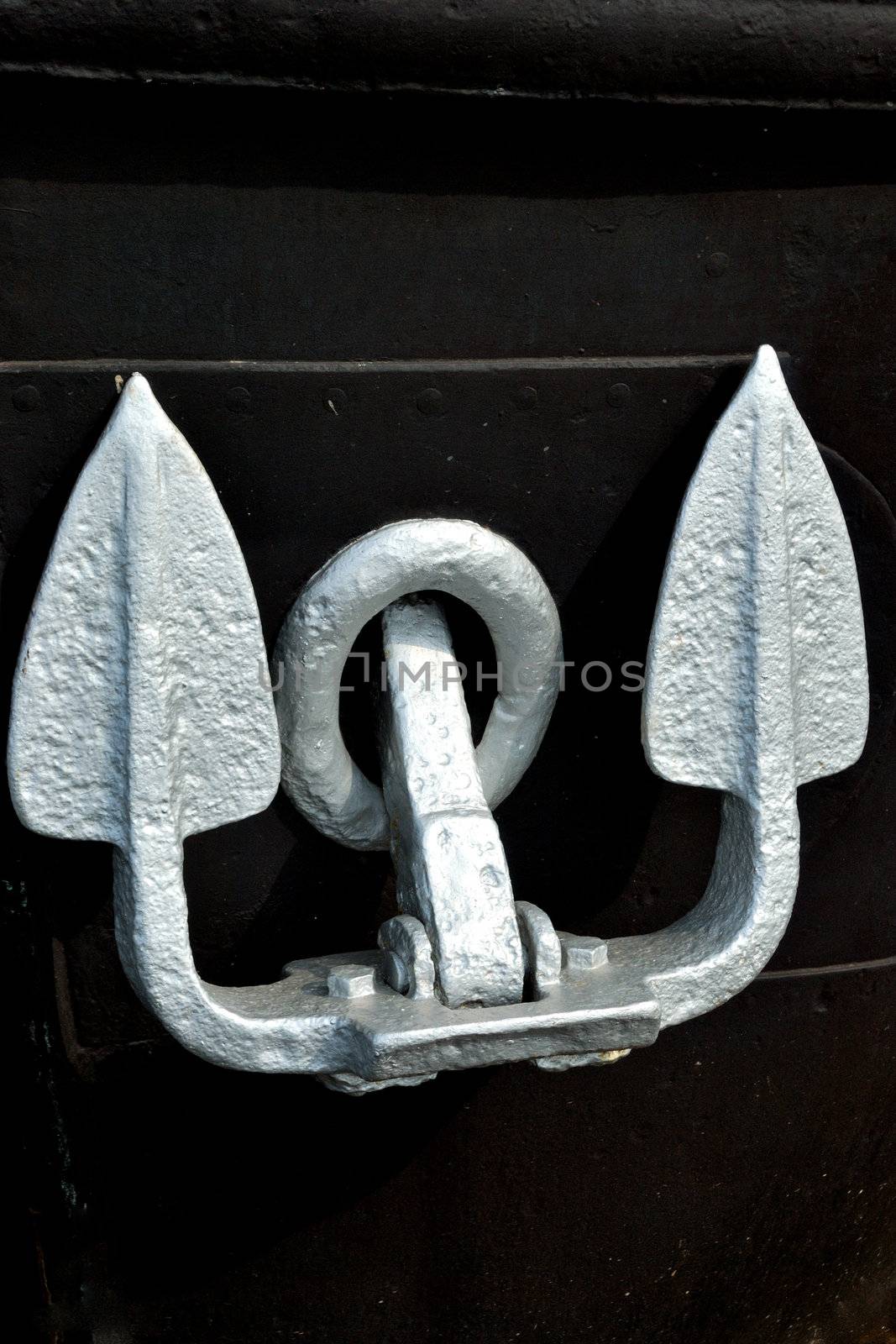 Silver Anchor with black background on Boat