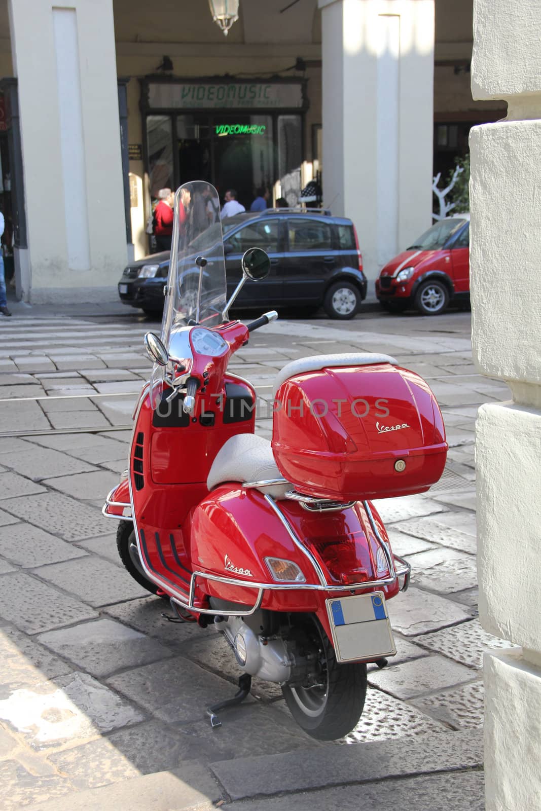 Red sooter, Turin, Italy, street, back, Vespa. Photo taken on october 2011. Scooter is in focus, background is out of focus.