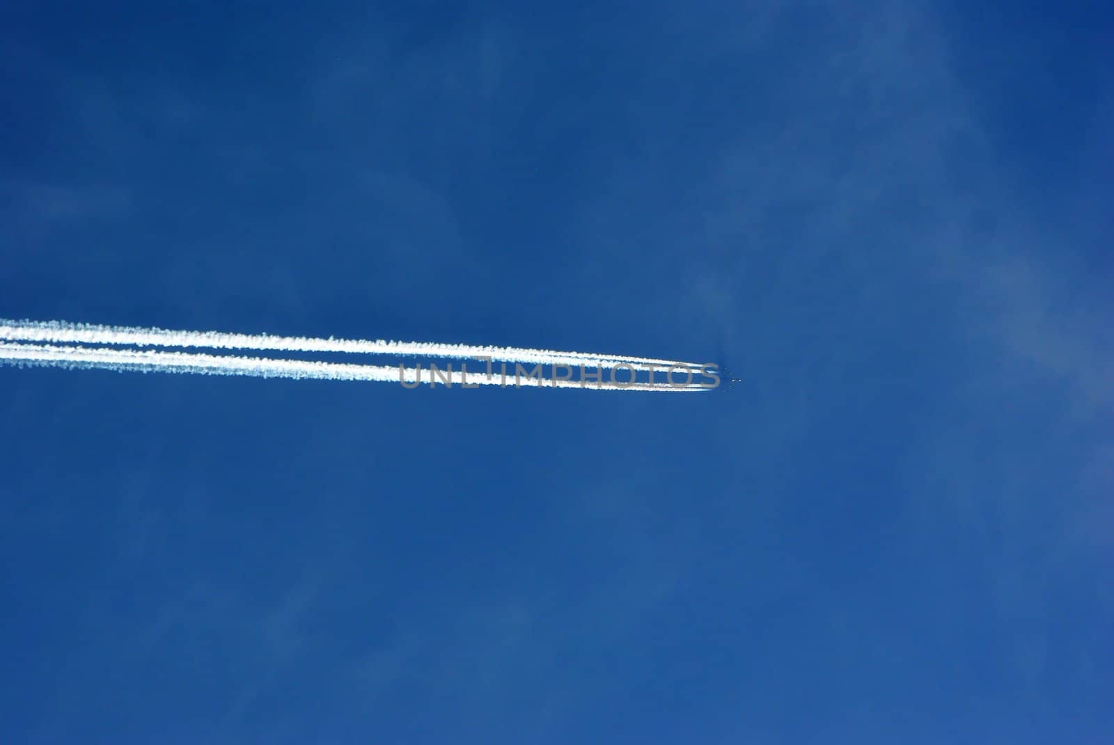 Jet plane with trace in the sky
