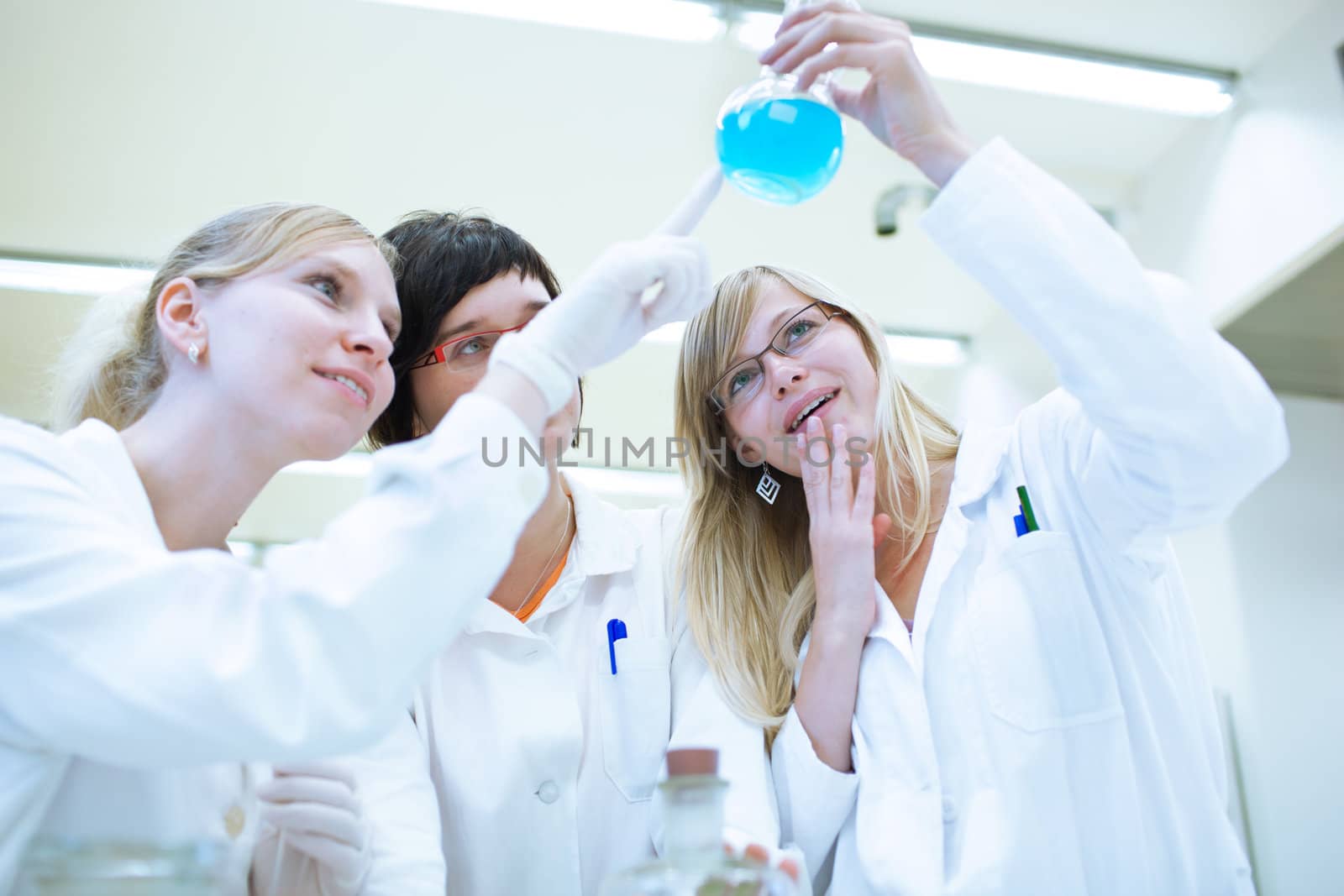 portrait of a female researcher carrying out research in a chemistry lab (color toned image; shallow DOF)