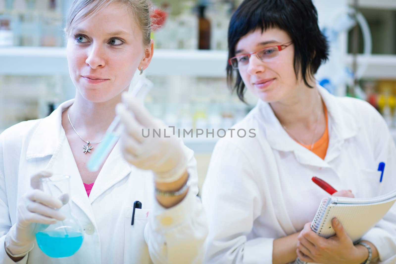 portrait of a female researcher carrying out research in a chemistry lab (color toned image; shallow DOF)