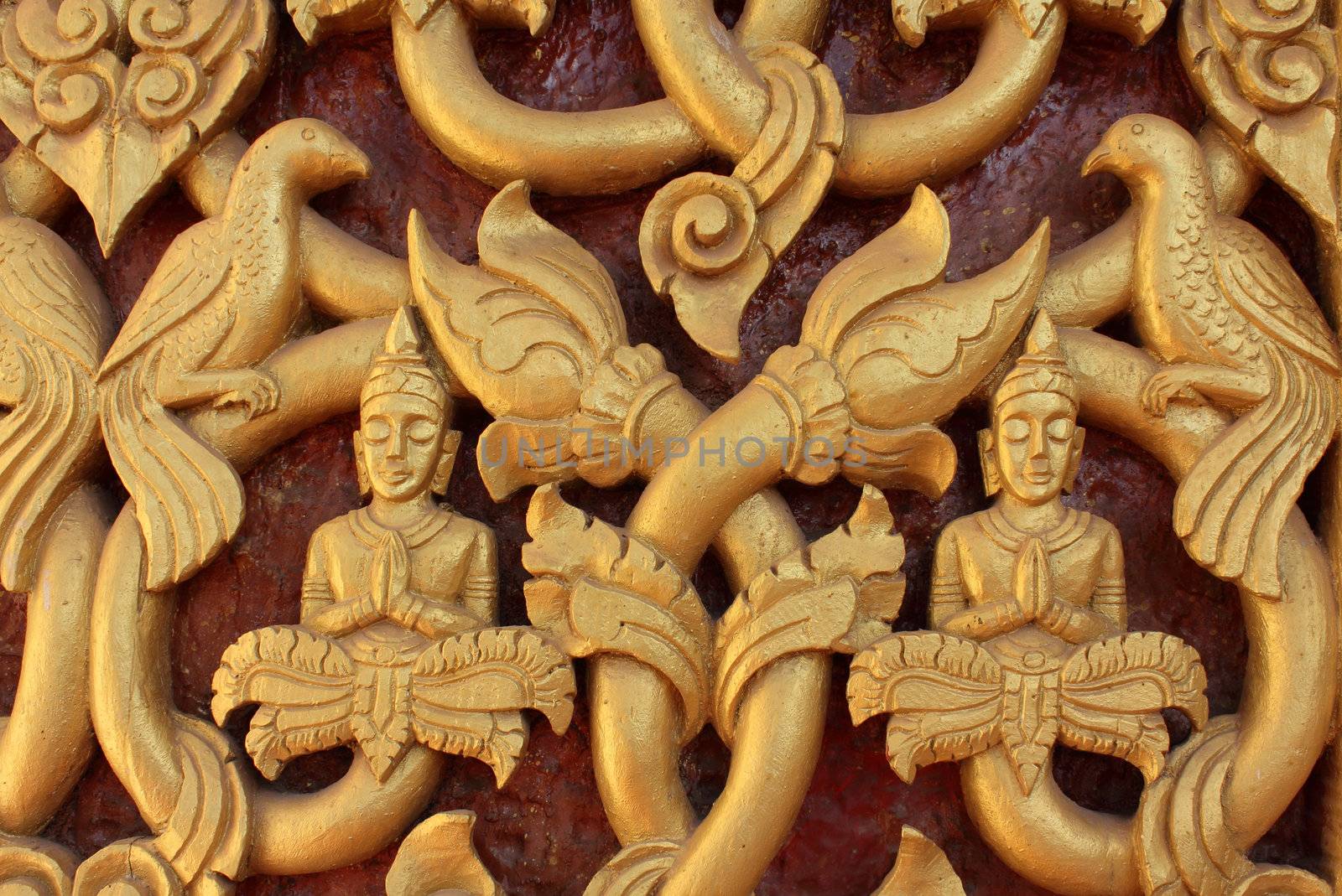 Decorated door in Buddhist temple at the capital of Vientiane, Laos
