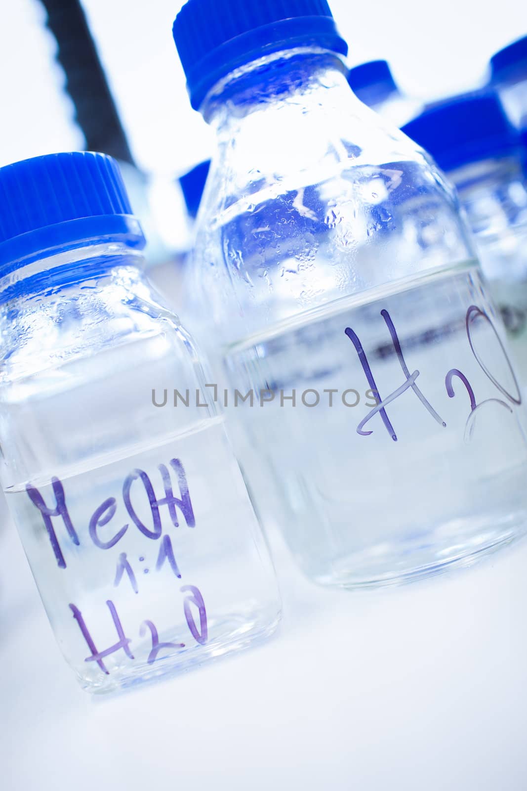 Glassware in a chemistry lab (shallow DOF; focus on the beakers in the foreground)