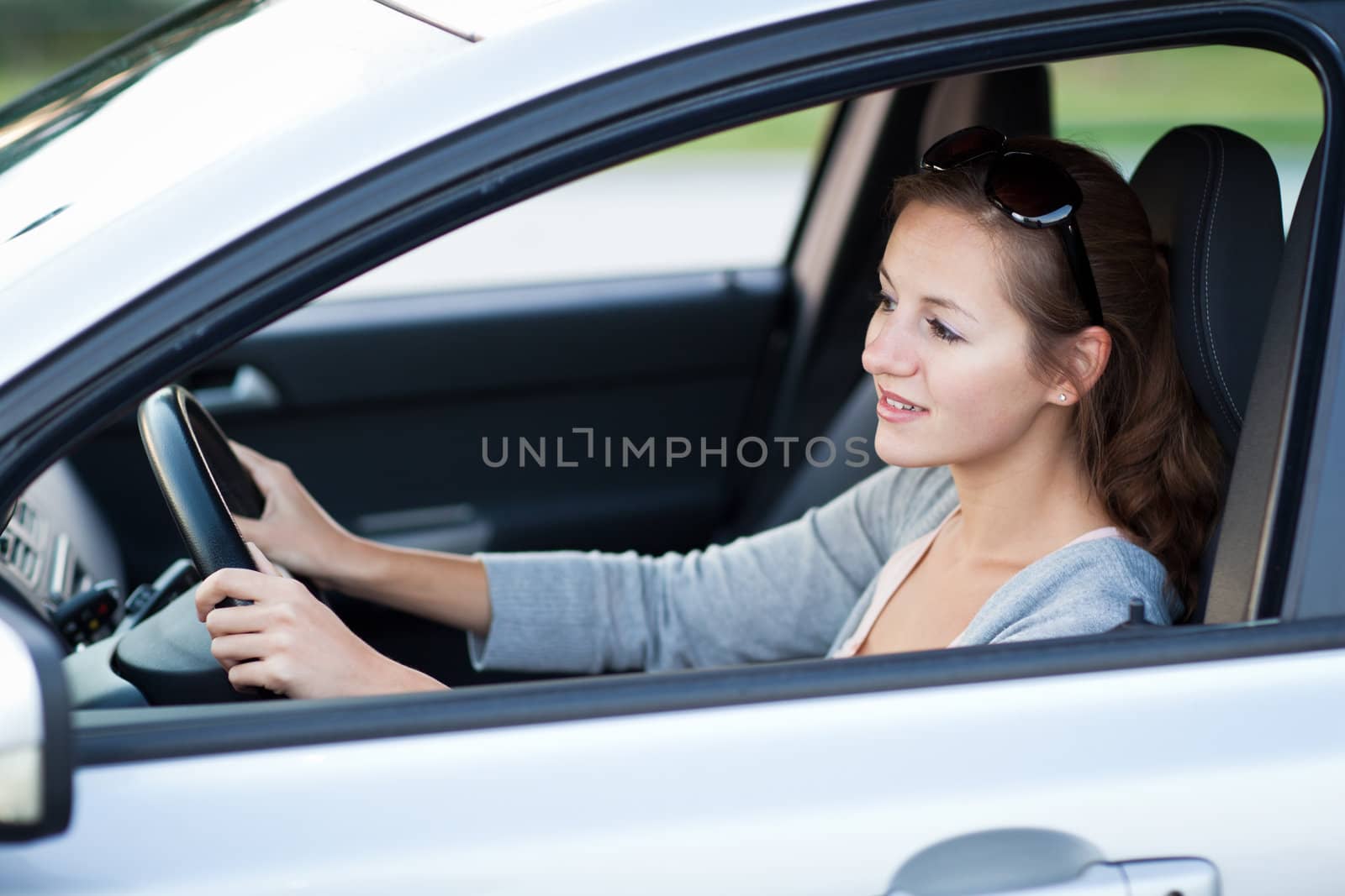 Pretty young woman driving her new car   by viktor_cap