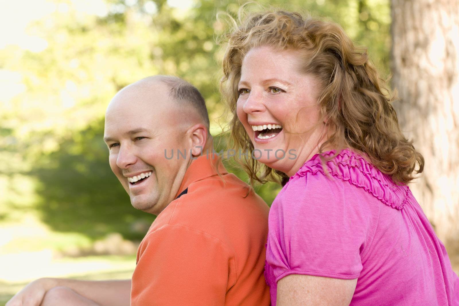 Happy Attractive Couple Laughing in the Park.