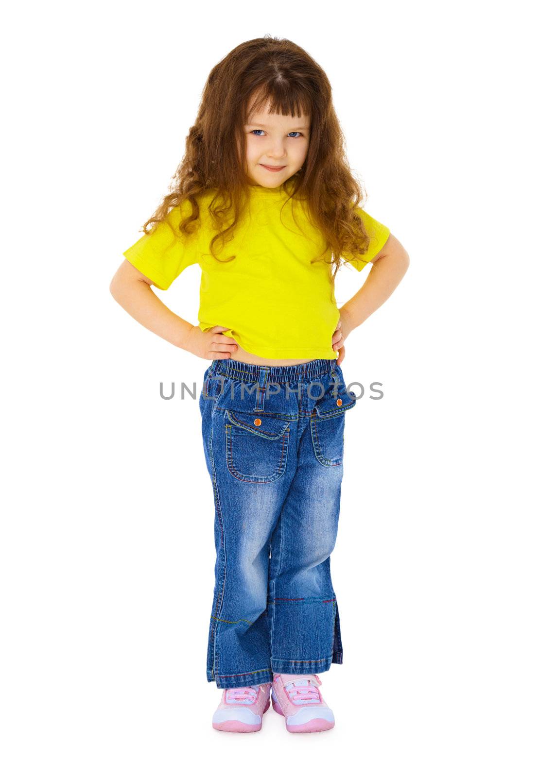 Serious little girl in jeans isolated on white background