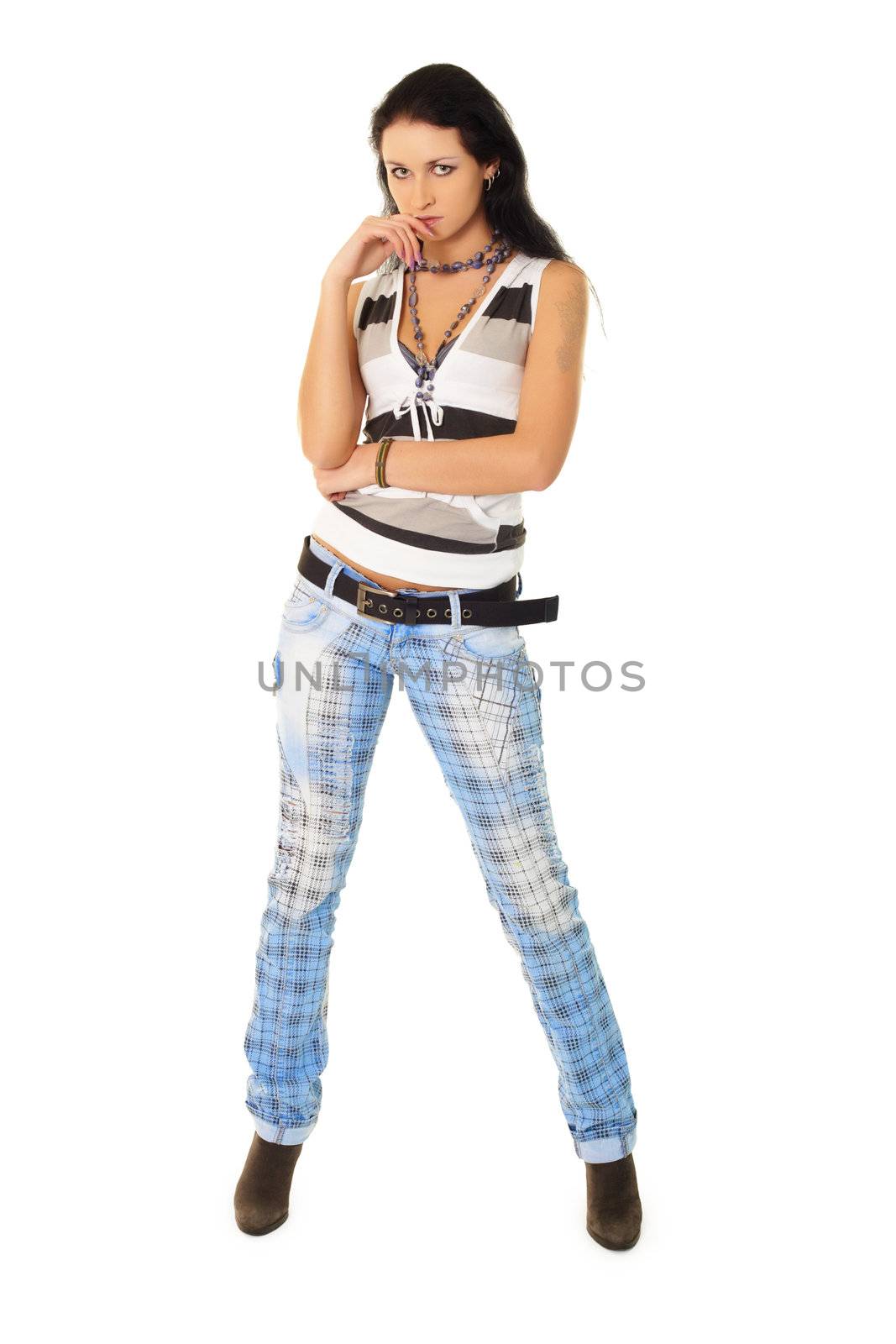 Fashionably dressed young woman in jeans isolated on a white background