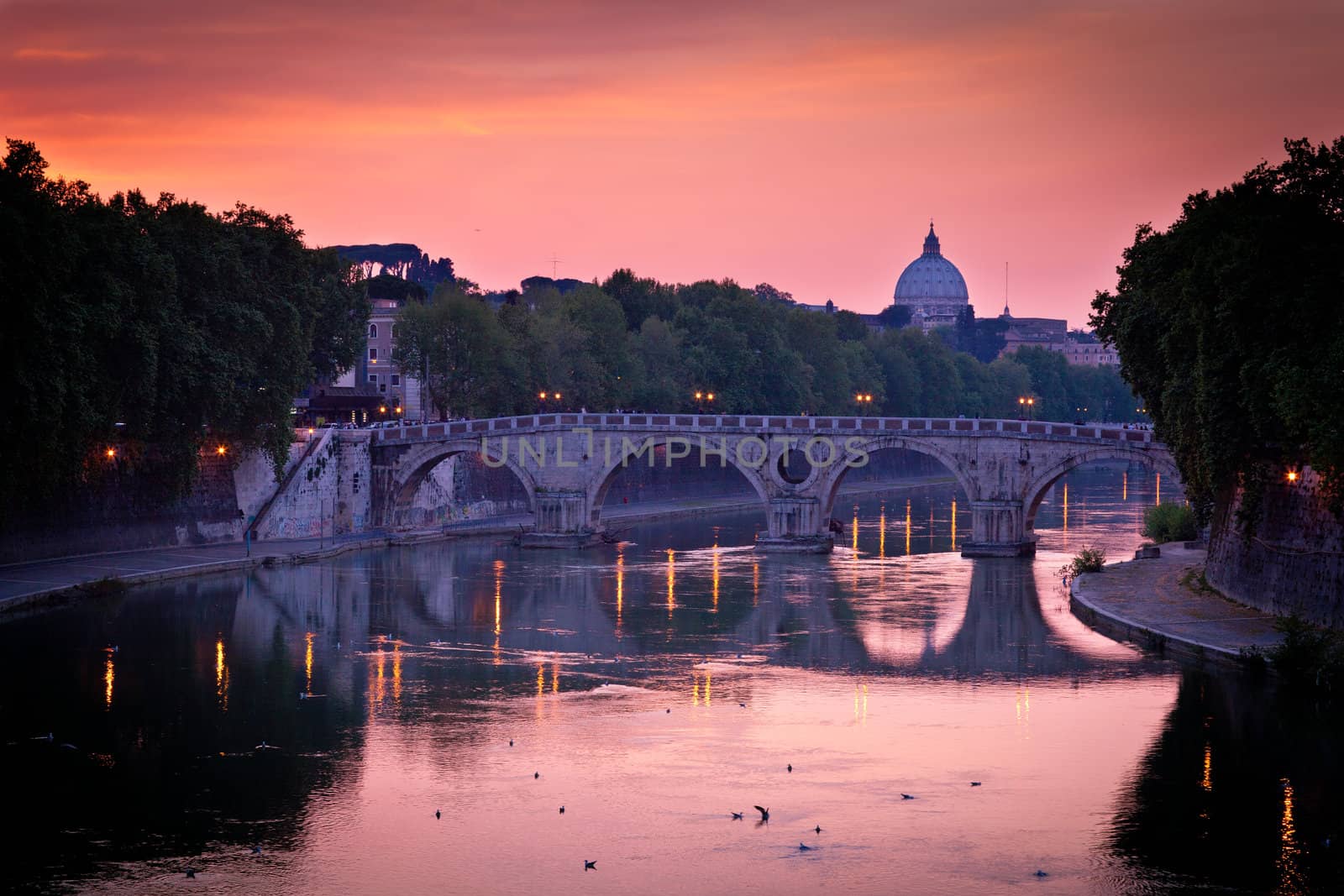 Panoramic view of St. Peter's Basilica and the Vatican City (with the river Tiber winding around it) - Rome, Italy