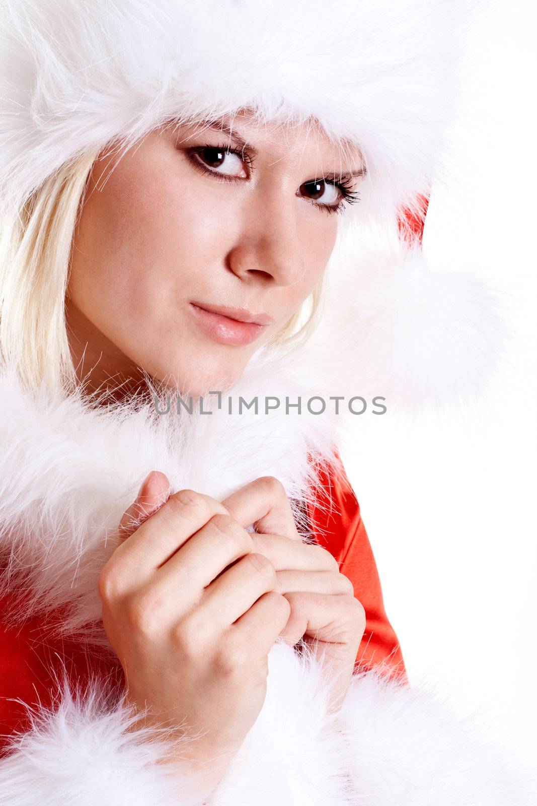 beautiful woman wearing santa claus clothes on a white background