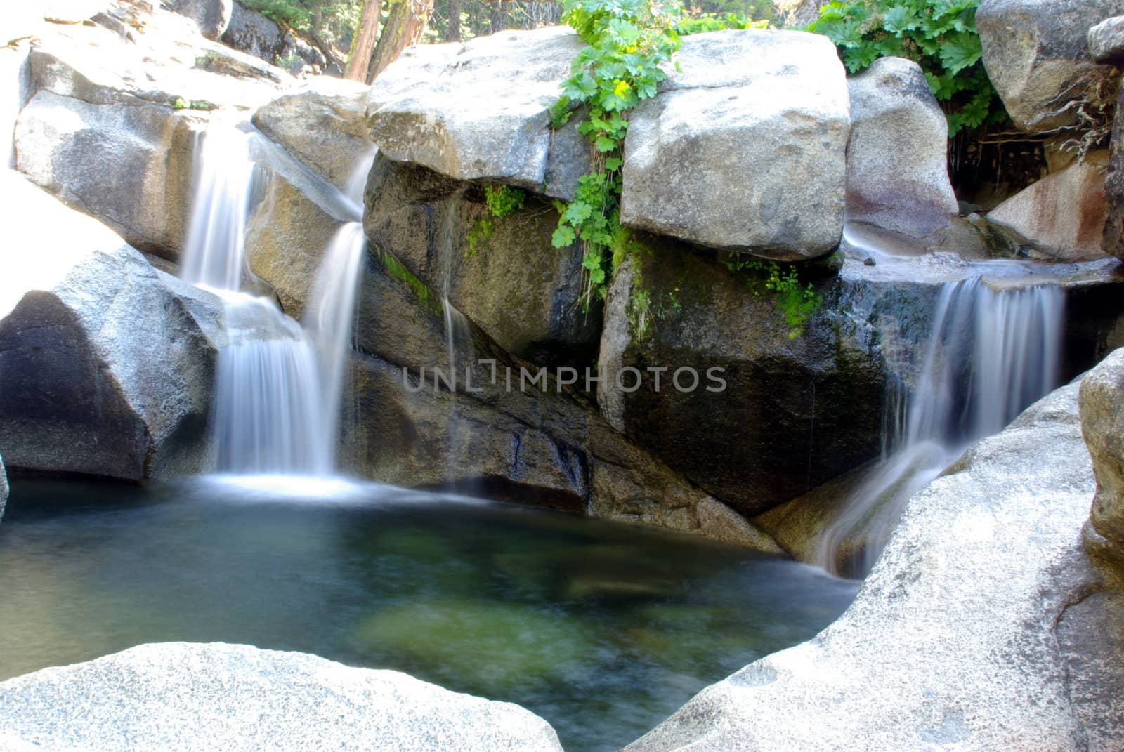 A waterfall in summertime located in the Crystal Basin Wilderness area in California.