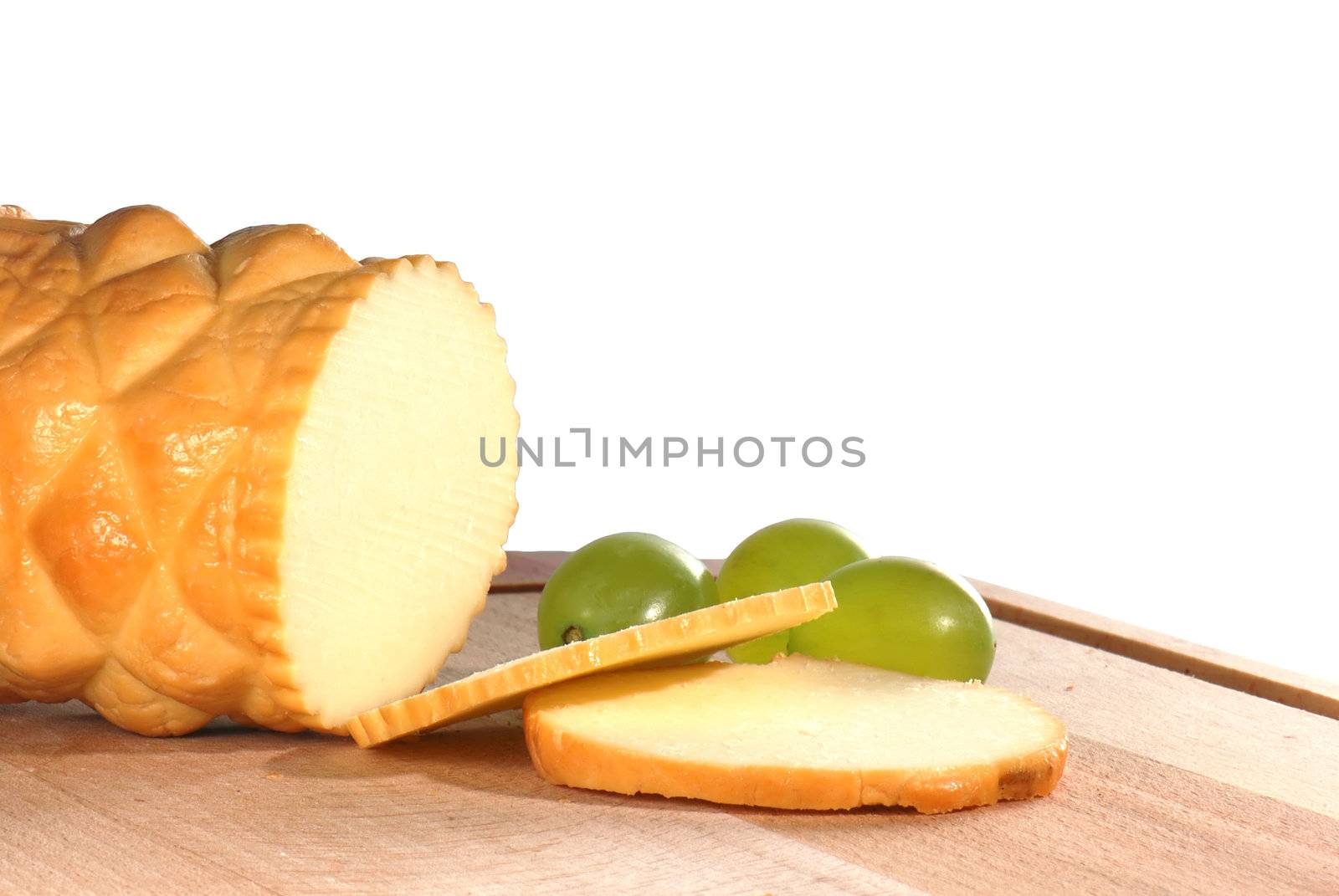 Traditional Polish cheese known as oscypek on a wooden board