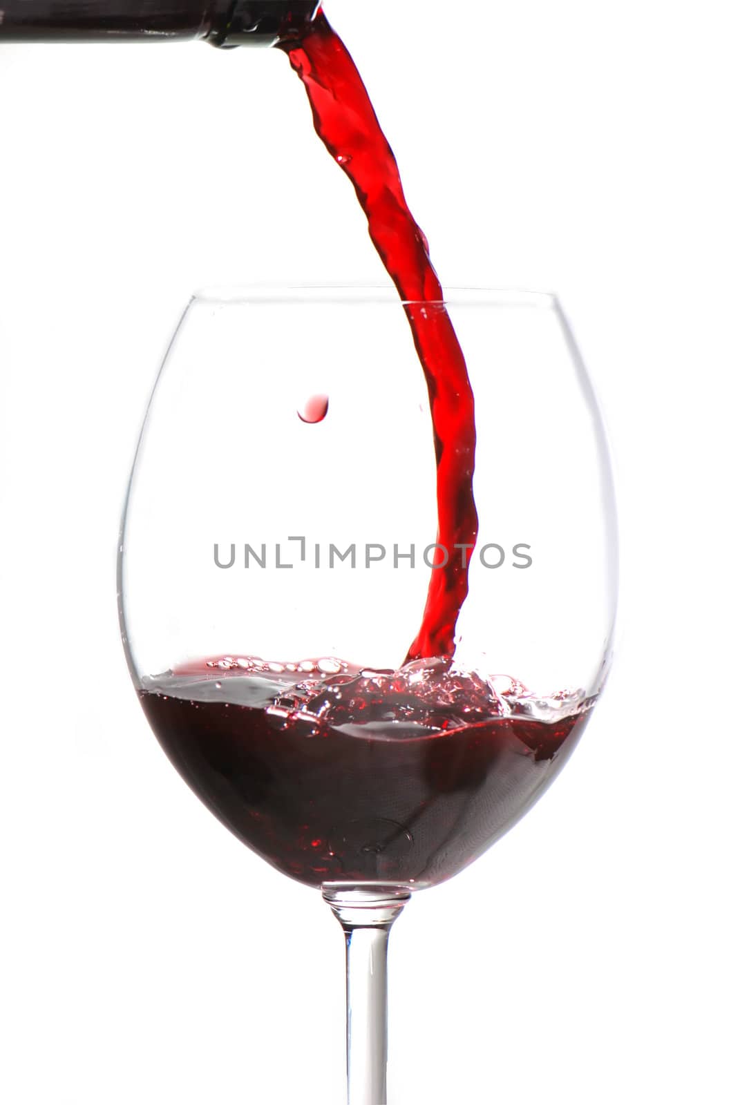 Pouring wine isolated on white background