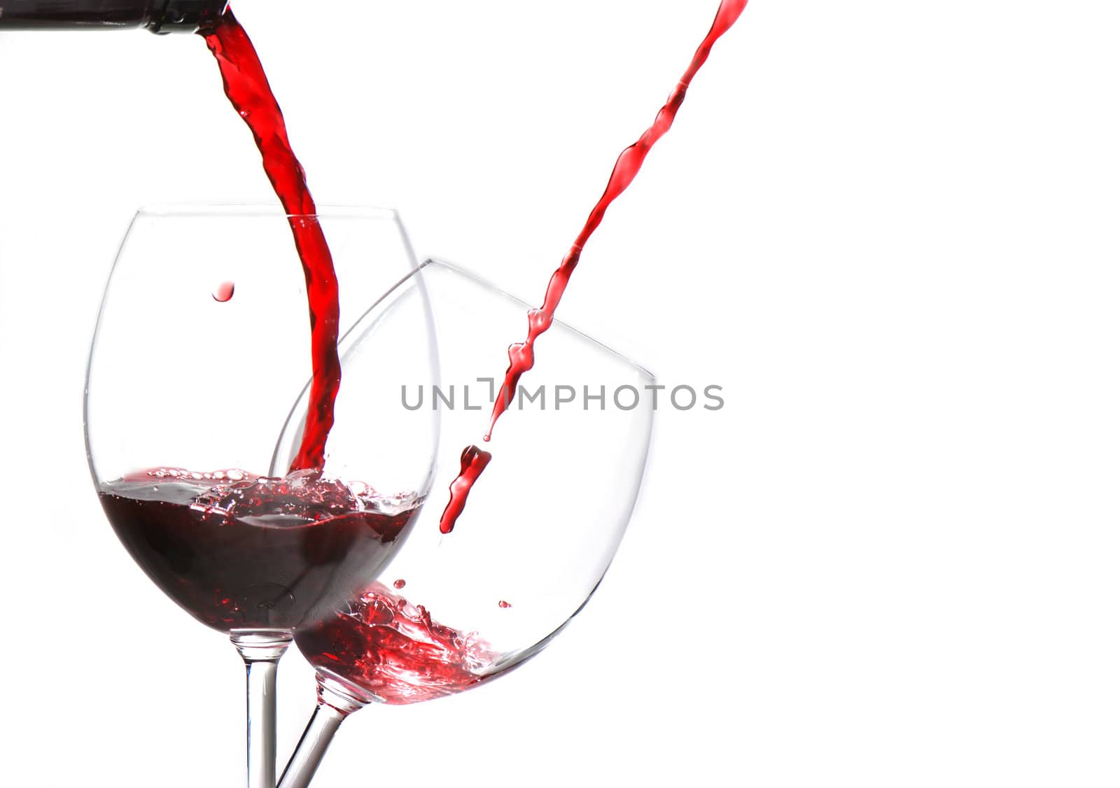 Pouring wine isolated on white background