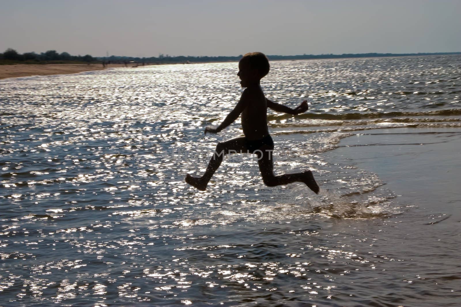 leisure series:  a boy jumping in the sea