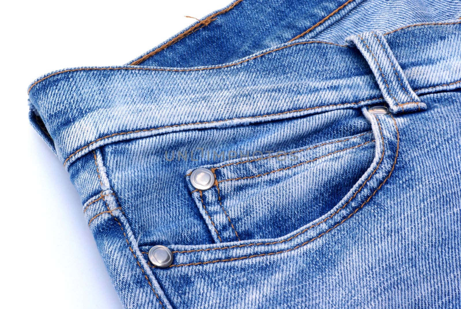 Part of a jeans against a white background.